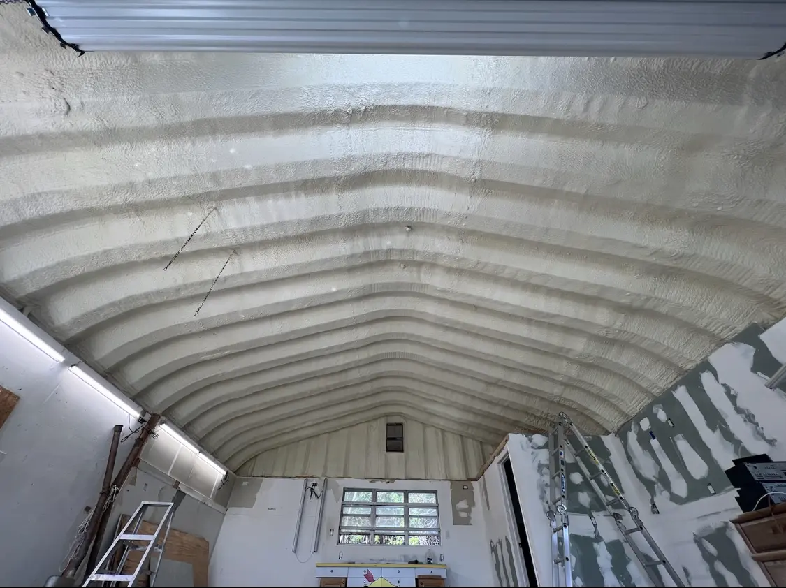 Spray polyurethane foam applied to the underside of a metal roof deck in Medina